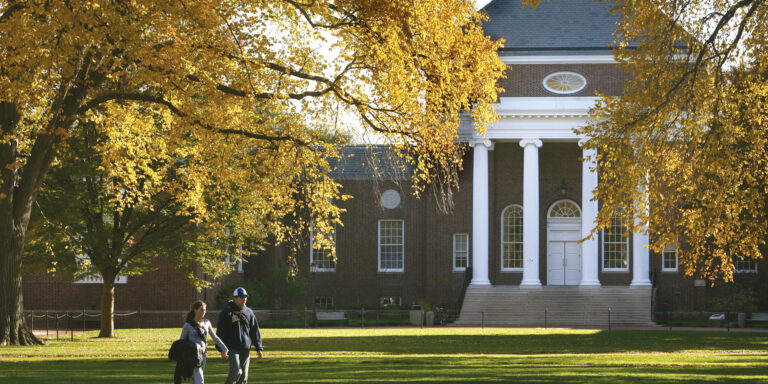 Two students walk across the quad at the University fo Delaware.