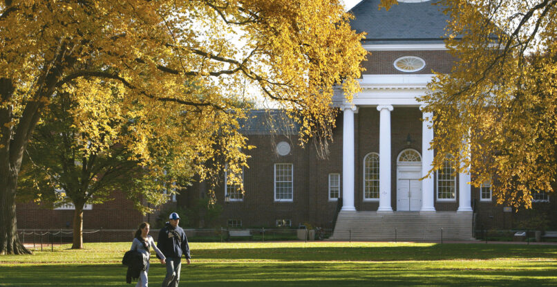 Two students walk across the quad at the University fo Delaware.