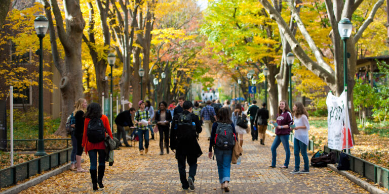 Students walk along Locust Walk in University City.